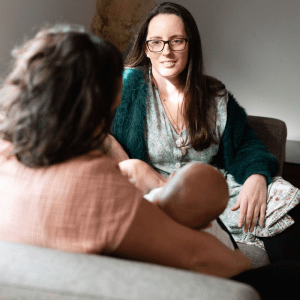 Rachael Flack providing postpartum counselling to a client at home