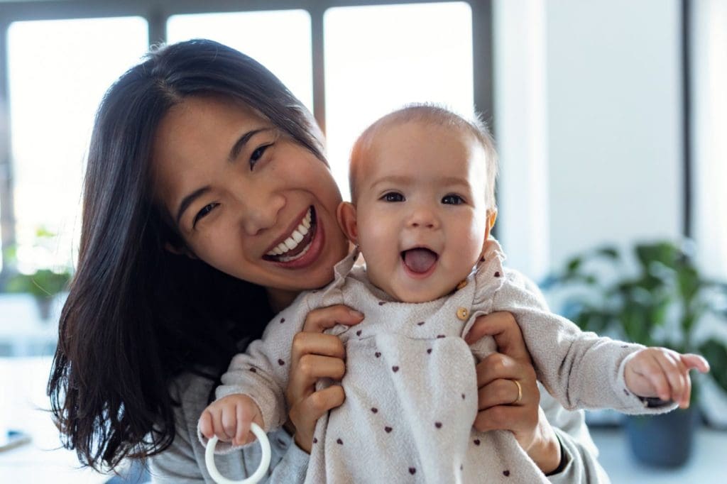Woman with smiling newborn in Frankston